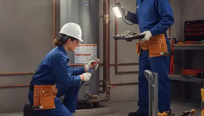Green Bay, WI plumber repairing a home pipe for plumbing repair service